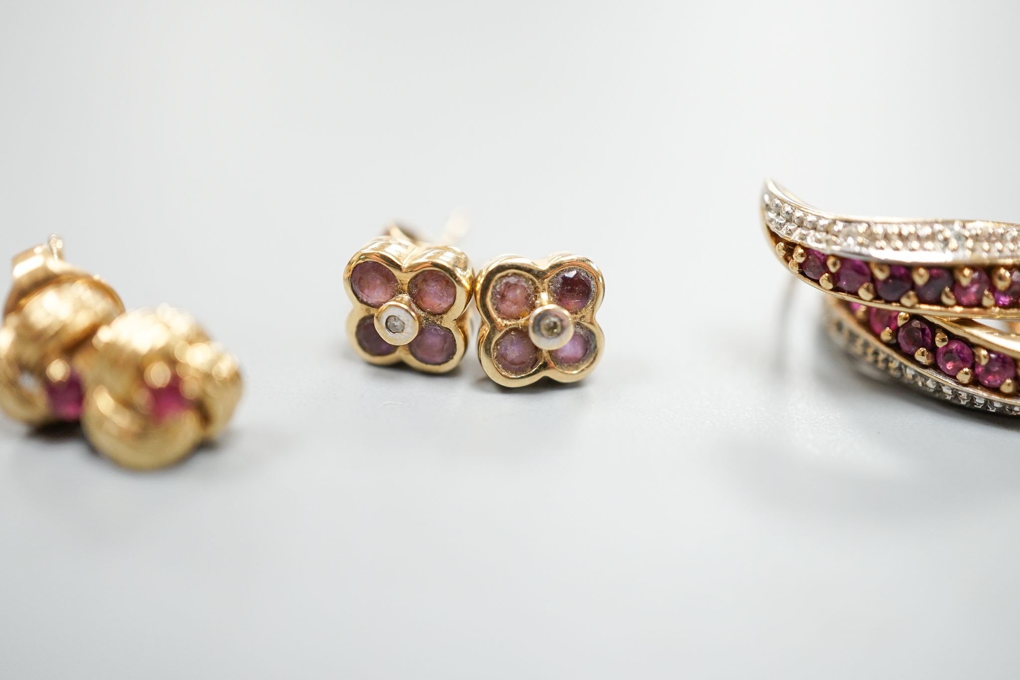 Three assorted modern pairs of 9ct and gem set ear studs